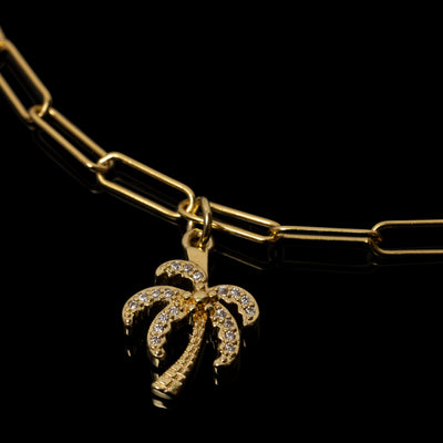 yellow gold over sterling silver paperclip bracelet with palm tree cubic zirconia charm